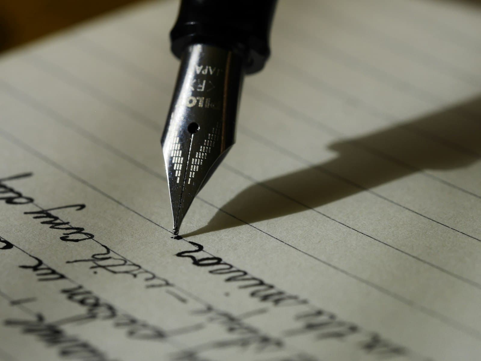 Handwritten notes and invitation papers on a desk